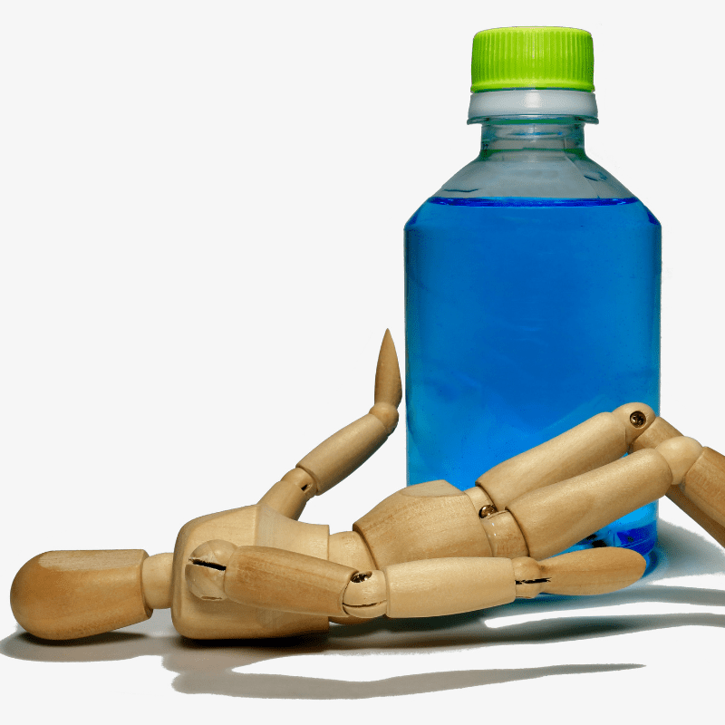 person lying on the floor due to heatstroke with a bottle of liquid next to him. This image goes along with coding for heatstroke with SIRS.